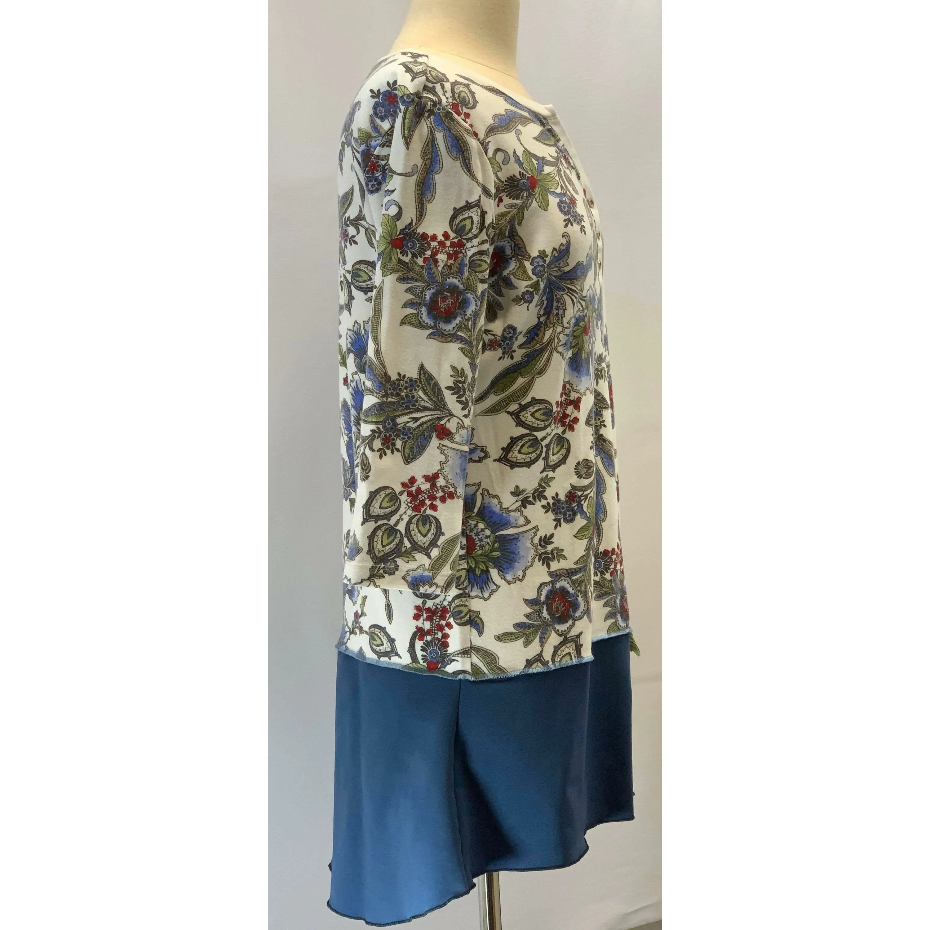 Blue Floral repurposed top into a new tunic size Large. The neckline has snaps to hold in place. The fabric on the bottom is new polyester.